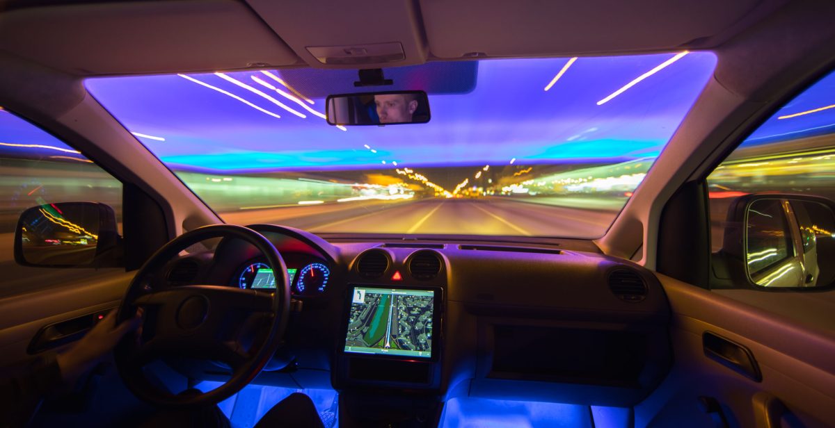 The man drive with navigation in the city highway. Evening night time